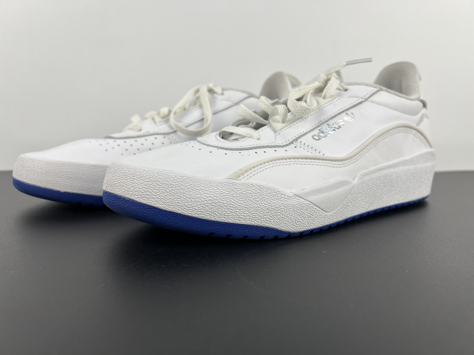 adidas White Low-Top Sneakers with Blue Rubber Sole