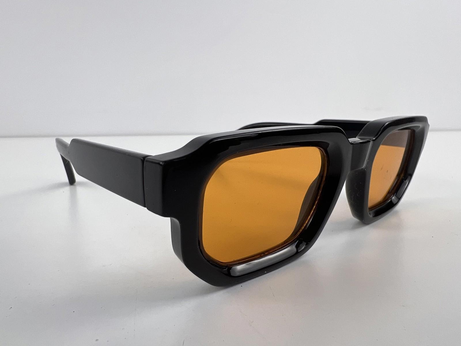 Retro black square sunglasses with amber lenses